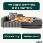 A cozy golden retriever sleeping soundly on a luxurious grey dog sofa bed that provides excellent support and warmth.