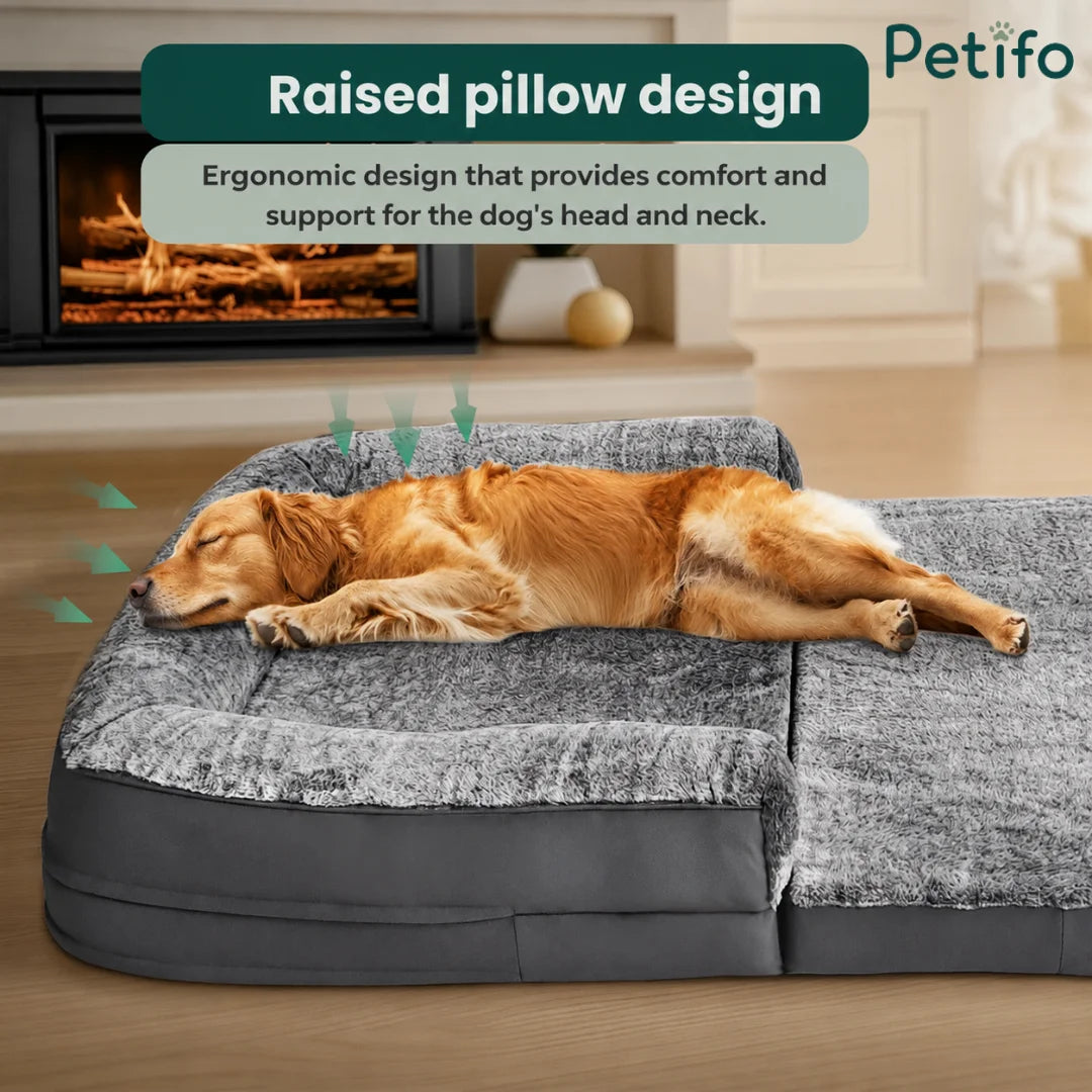 A golden retriever sleeping comfortably on a pet bed with an ergonomic raised pillow design that supports the dog's head and neck.