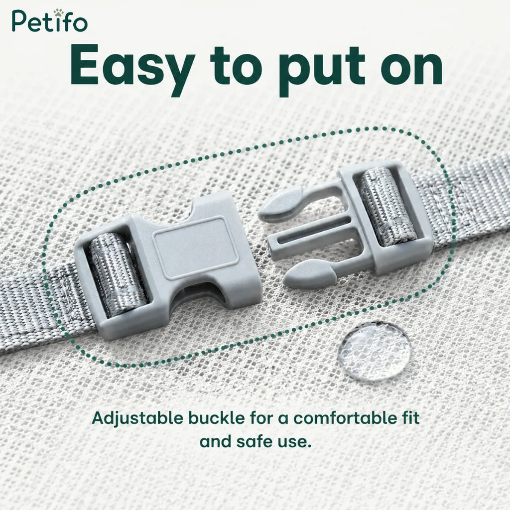 Close-up view of the adjustable gray buckle on the dog cooling vest.