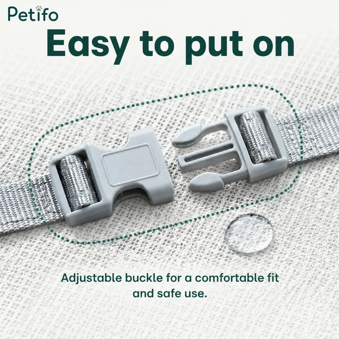 Close-up view of the adjustable gray buckle on the dog cooling vest.