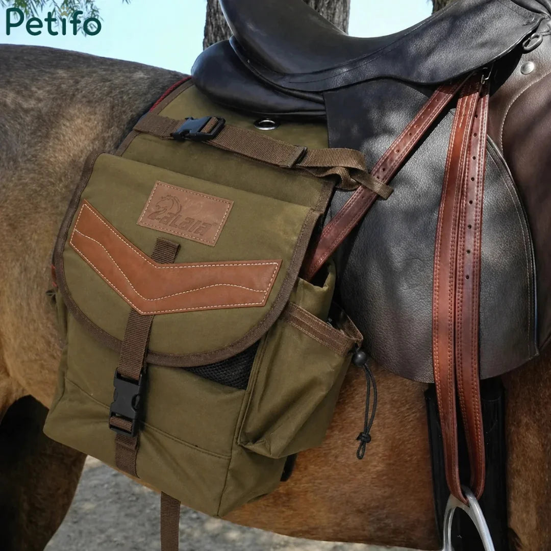 Equestrian saddle bag attached beside a black English saddle on a horse.