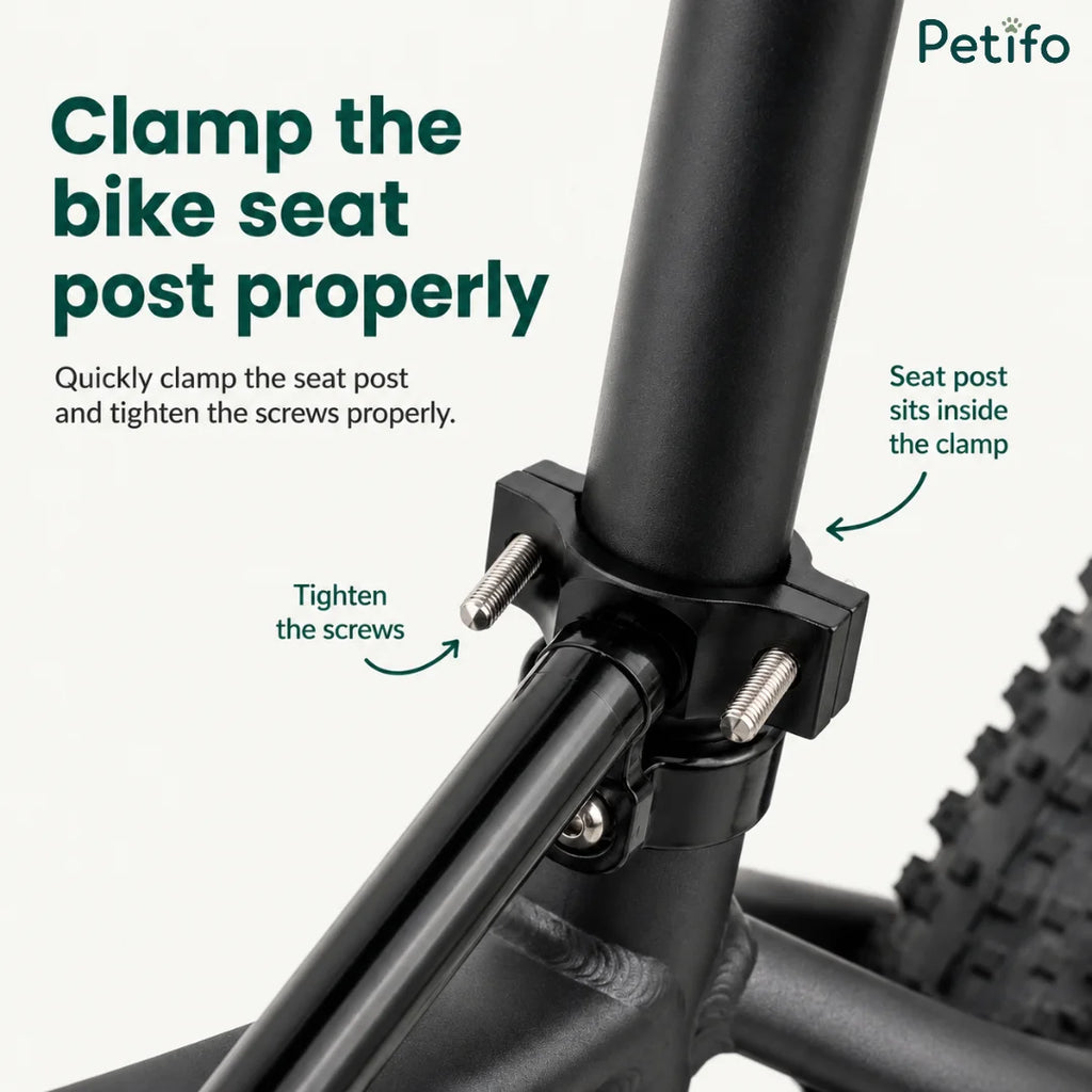 Petifo bicycle dog leash attached to a bicycle seat post with a black dog walking safely alongside on a paved path.