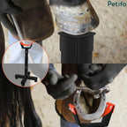 Farrier using tools to shoe a horse's hoof supported by the adjustable black and orange stand.