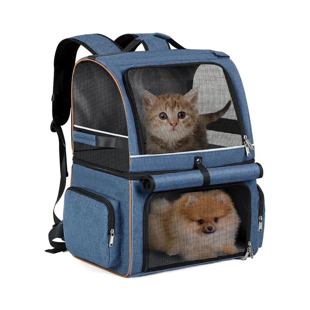 Blue denim-style double-compartment pet carrier backpack holding a cat on top and a small dog below.