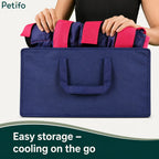 Person packing blue and pink horse ice wraps into a matching portable storage bag.