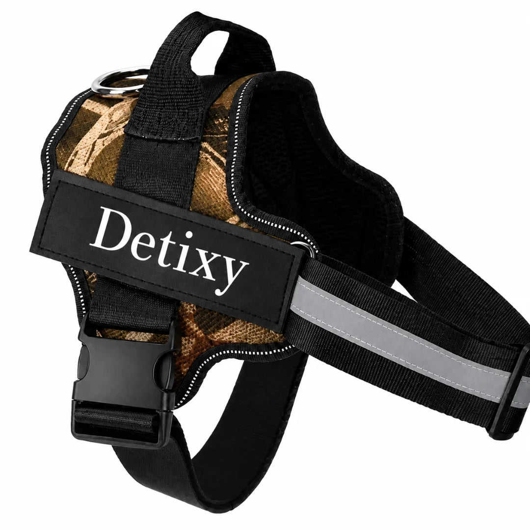 A brown camouflage patterned reflective dog harness equipped with a sturdy handle, metal leash ring, and a "Detixy" label.