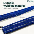 Close-up of durable, soft, and washable blue webbing material featuring extra padding and reflective stitching on a dog leash.