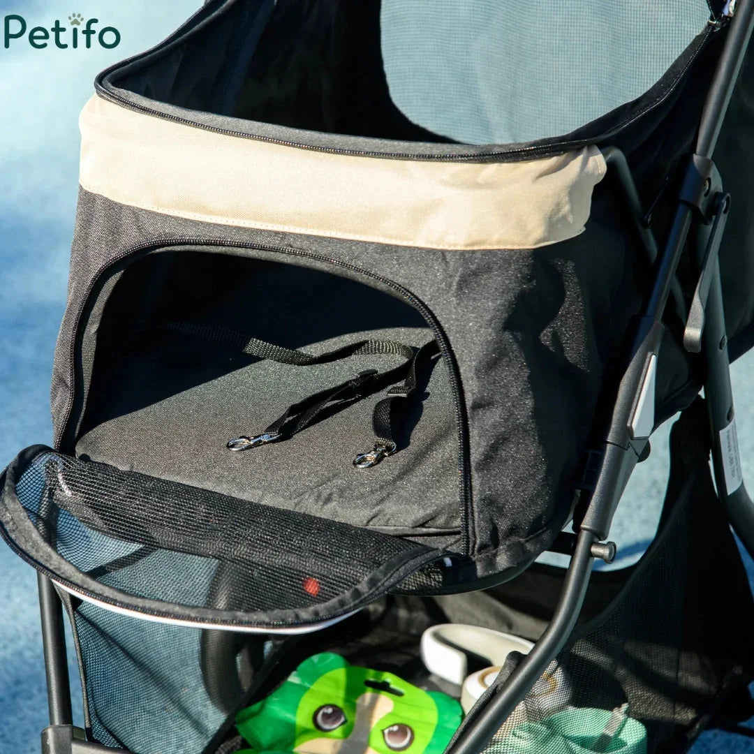 Close-up of the Petifo dog stroller cabin with built-in double safety leashes.