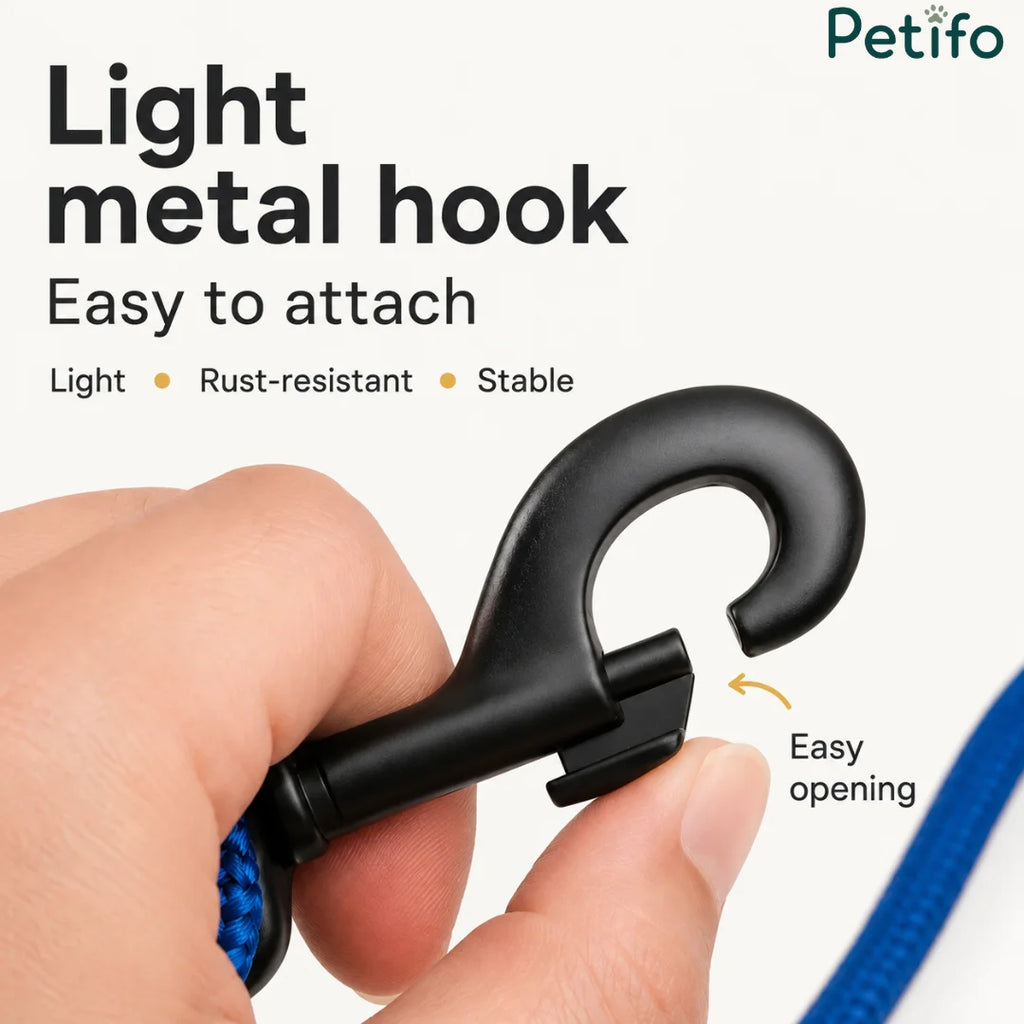 Close-up of a lightweight, rust-resistant, and stable metal dog leash hook being easily opened by hand.