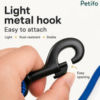 Close-up of a lightweight, rust-resistant, and stable metal dog leash hook being easily opened by hand.