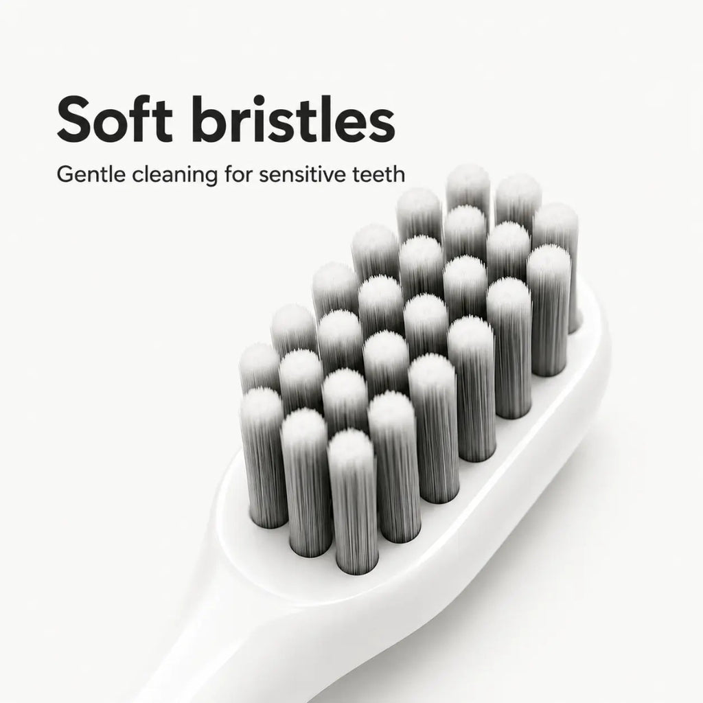 Close-up of a white electric dog toothbrush head with dense, soft bristles for sensitive teeth.