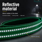 Close-up of green reflective material on a dog leash designed for increased visibility and safety during evening walks.