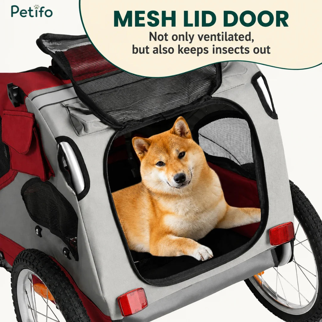 A close-up view of the Petifo pet bike trailer showing a Shiba Inu inside the cabin with the top mesh lid door open for ventilation and insect protection.