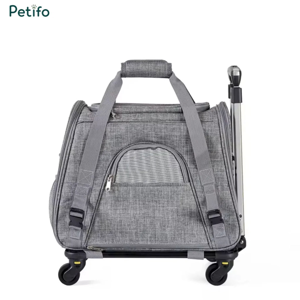 Compact grey pet travel bag with a sturdy top handle and smooth-rolling wheels for easy transport.