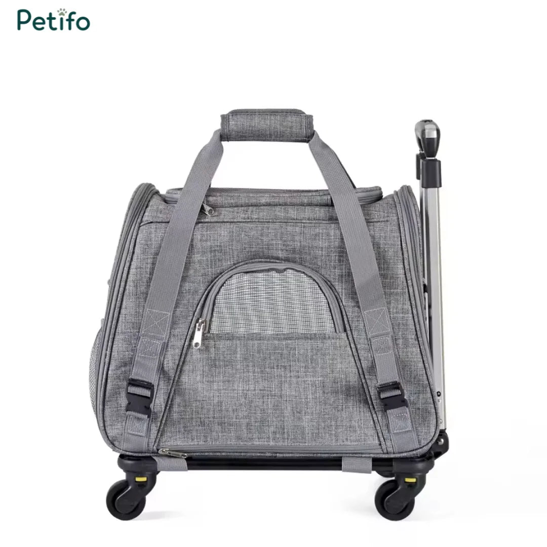 Compact grey pet travel bag with a sturdy top handle and smooth-rolling wheels for easy transport.