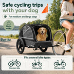 A person cycling outdoors with a black pet trailer that supports medium to large dogs up to 40 kg, compatible with mountain, folding, and standard bikes.