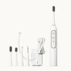 White professional electric pet toothbrush and water flosser combo kit with multiple brush heads and attachments.