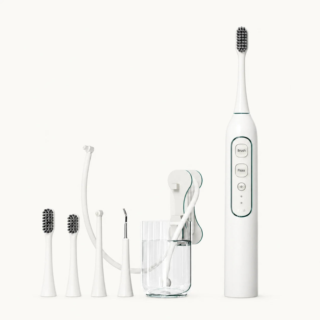 White professional electric pet toothbrush and water flosser combo kit with multiple brush heads and attachments.