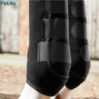 Close-up of durable black horse leg wraps highlighting the secure fit and heavy-duty stitching.