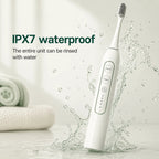 IPX7 waterproof electric pet toothbrush being splashed with water to showcase easy cleaning.