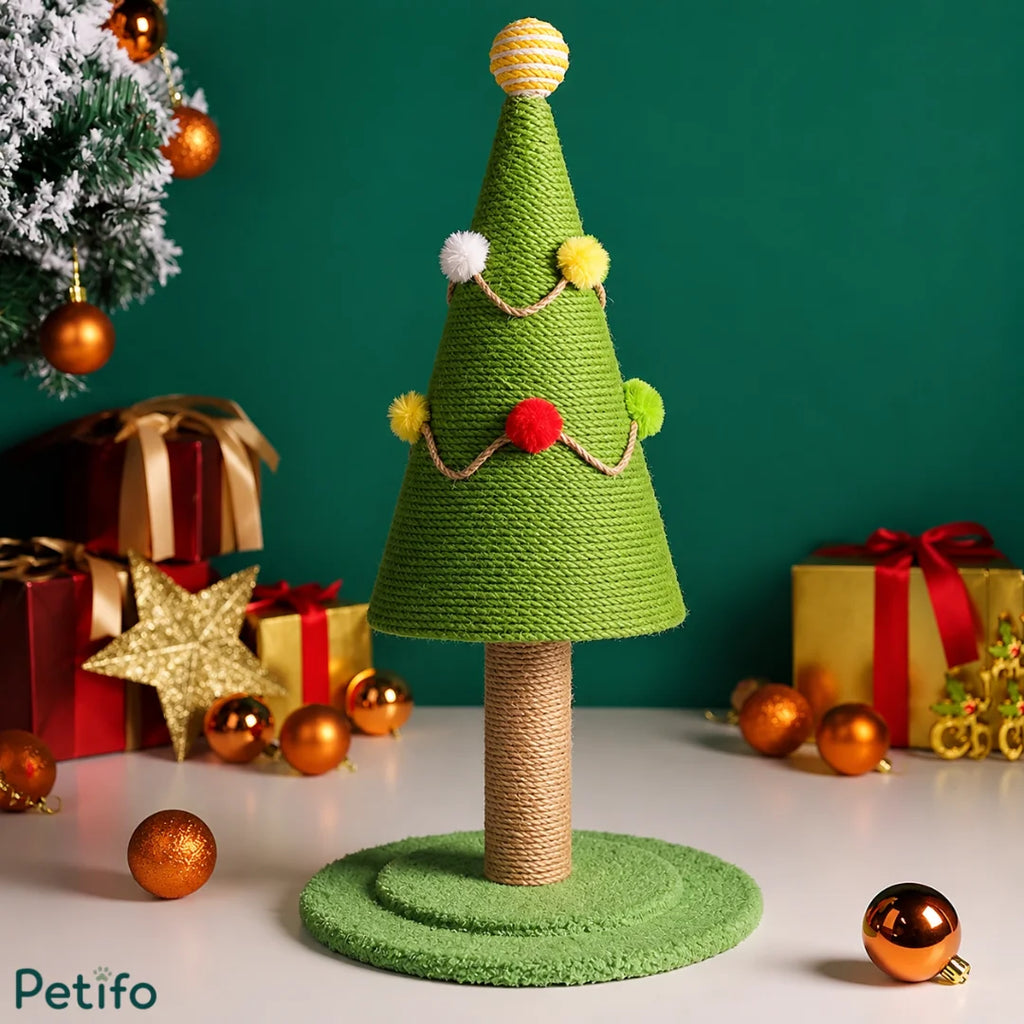 Festive product photography of a Christmas tree cat scratching post set against a green background with holiday ornaments.