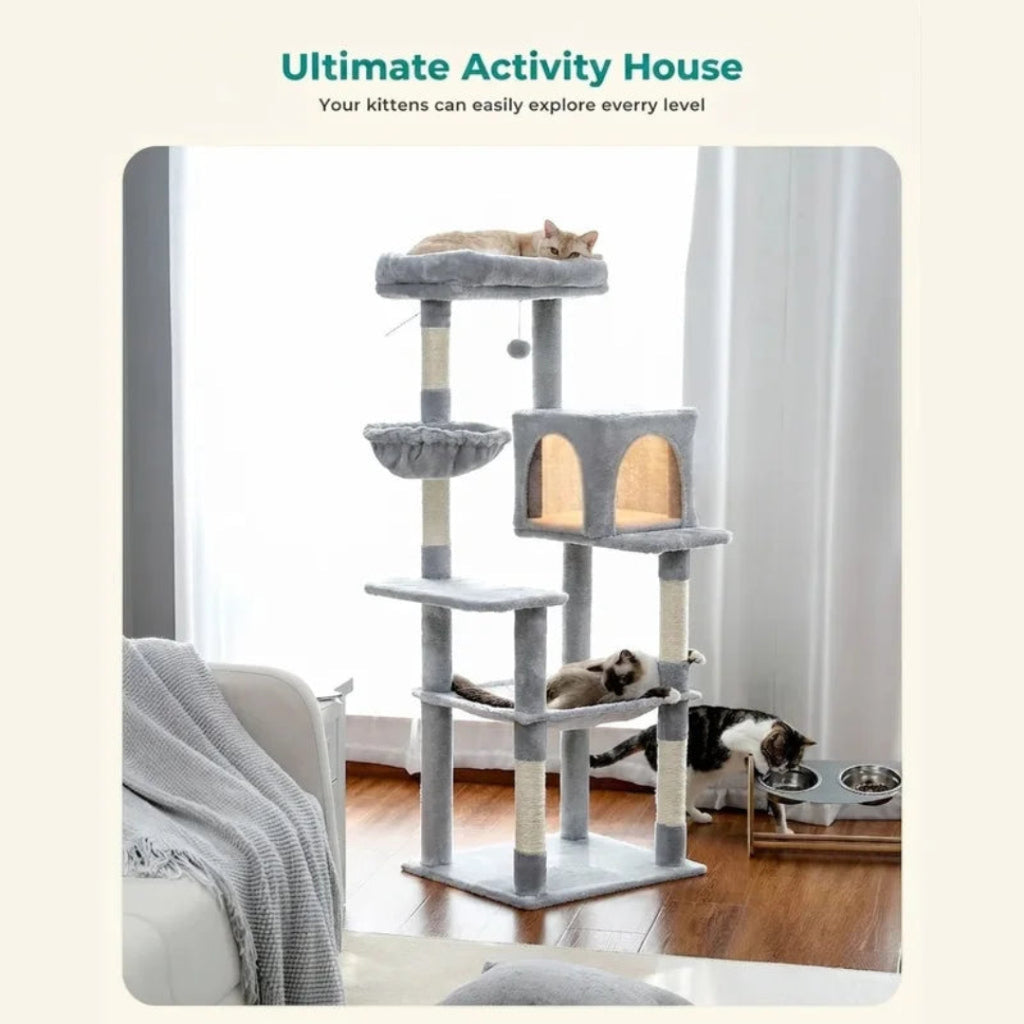 Labeled as an "Ultimate Activity House," this image shows a grey cat tree with an illuminated central condo and cats interacting with the various levels.