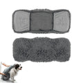 Grey microfiber dog drying towel layout and demonstration with a dog.