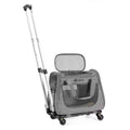 Grey rolling pet carrier with an extended telescoping handle and breathable mesh windows for travel.