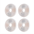 Grid arrangement of four circular replacement water fountain filters for pets.