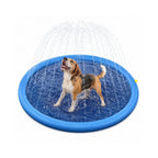 Beagle splashing and looking up happily inside an outdoor blue dog sprinkler pool.