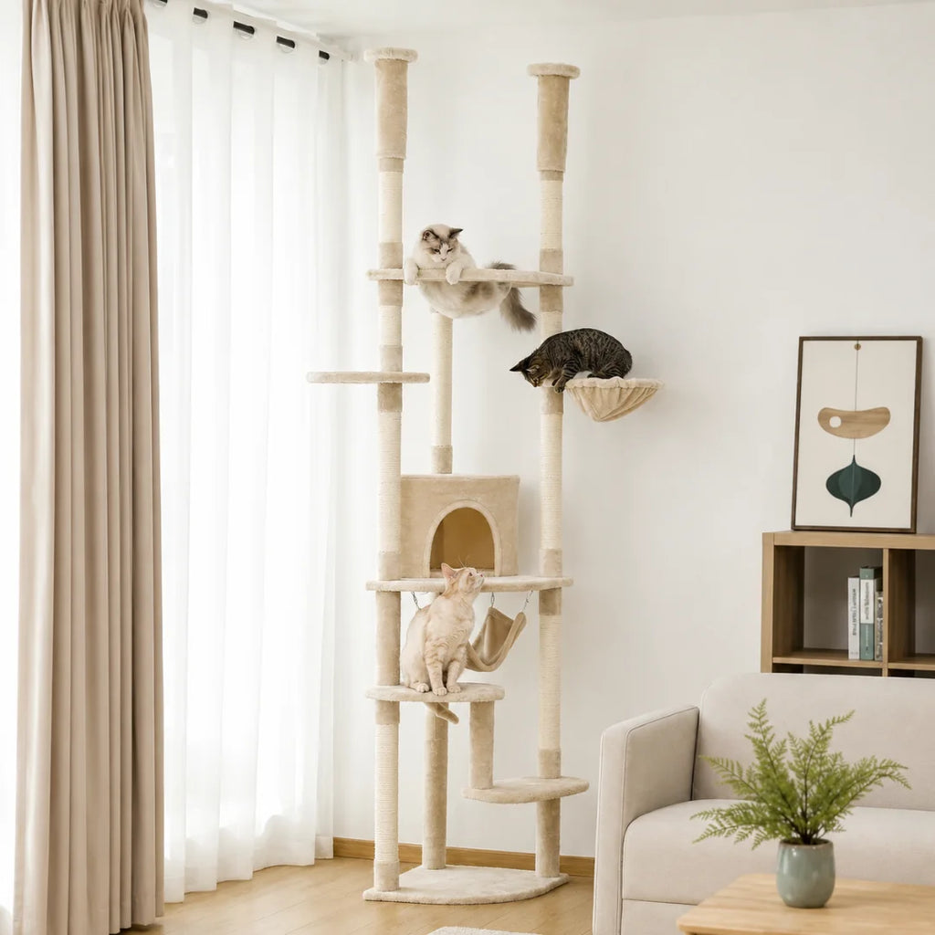 Large beige multi-level cat tower featuring multiple platforms and climbing space for three cats in a bright, cozy home interior.