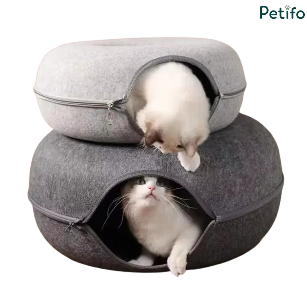 Two stacked felt cat beds in light and dark gray with playful kittens peering out of the openings.