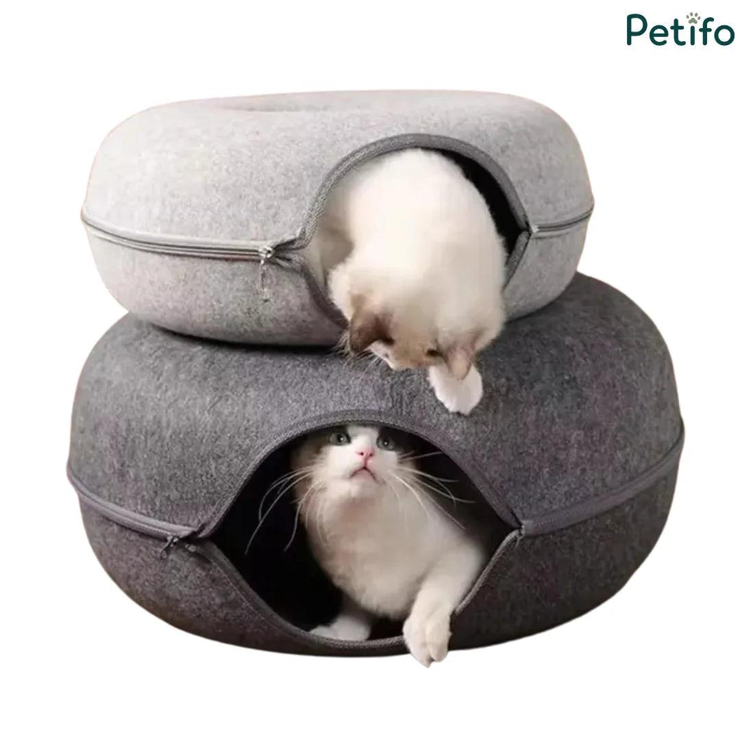 Two stacked felt cat beds in light and dark gray with playful kittens peering out of the openings.
