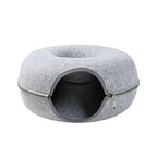 Empty light gray felt doughnut cat cave bed featuring a sturdy wrap-around zipper design.