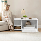 A cozy living room setting where a woman sits on a sofa next to a Petifo white cat litter enclosure, showcasing its seamless design as home furniture.