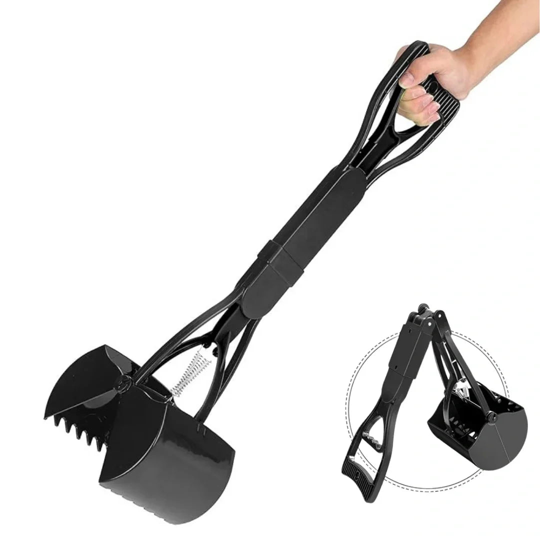 Hand holding a black long-handled dog pooper scooper with a folded storage view next to it.
