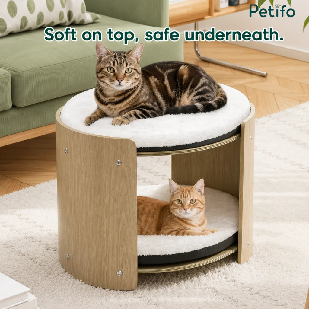 A comfortable multi-level cat condo with soft cushions that provides a cozy spot for cats to sleep on top or hide underneath.