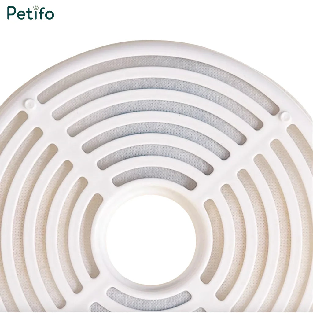 Close-up view of a circular white multi-stage pet water fountain filter element.