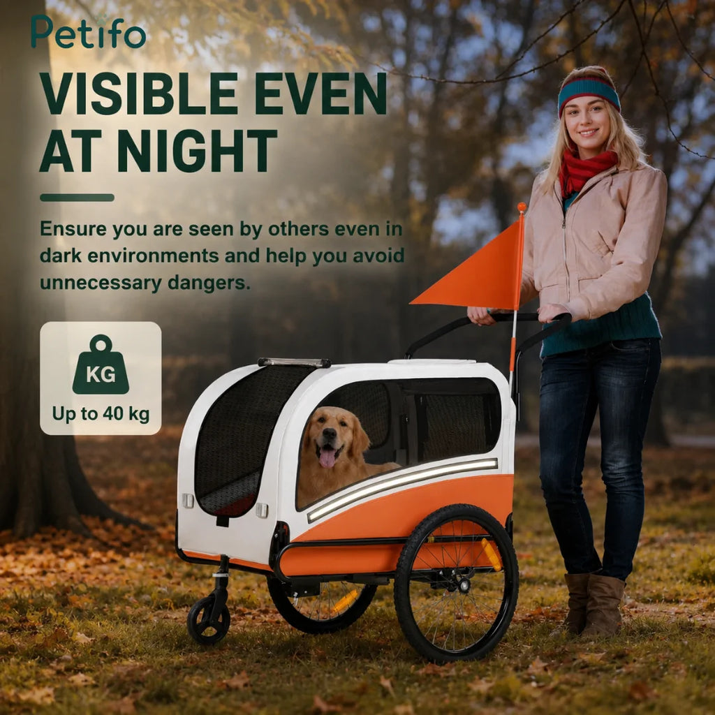 A person walking an orange pet stroller at night, highlighting visibility features and a 40 kg weight capacity.