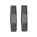 Pair of black flexible rubber grooming brushes displayed side by side for comparison.
