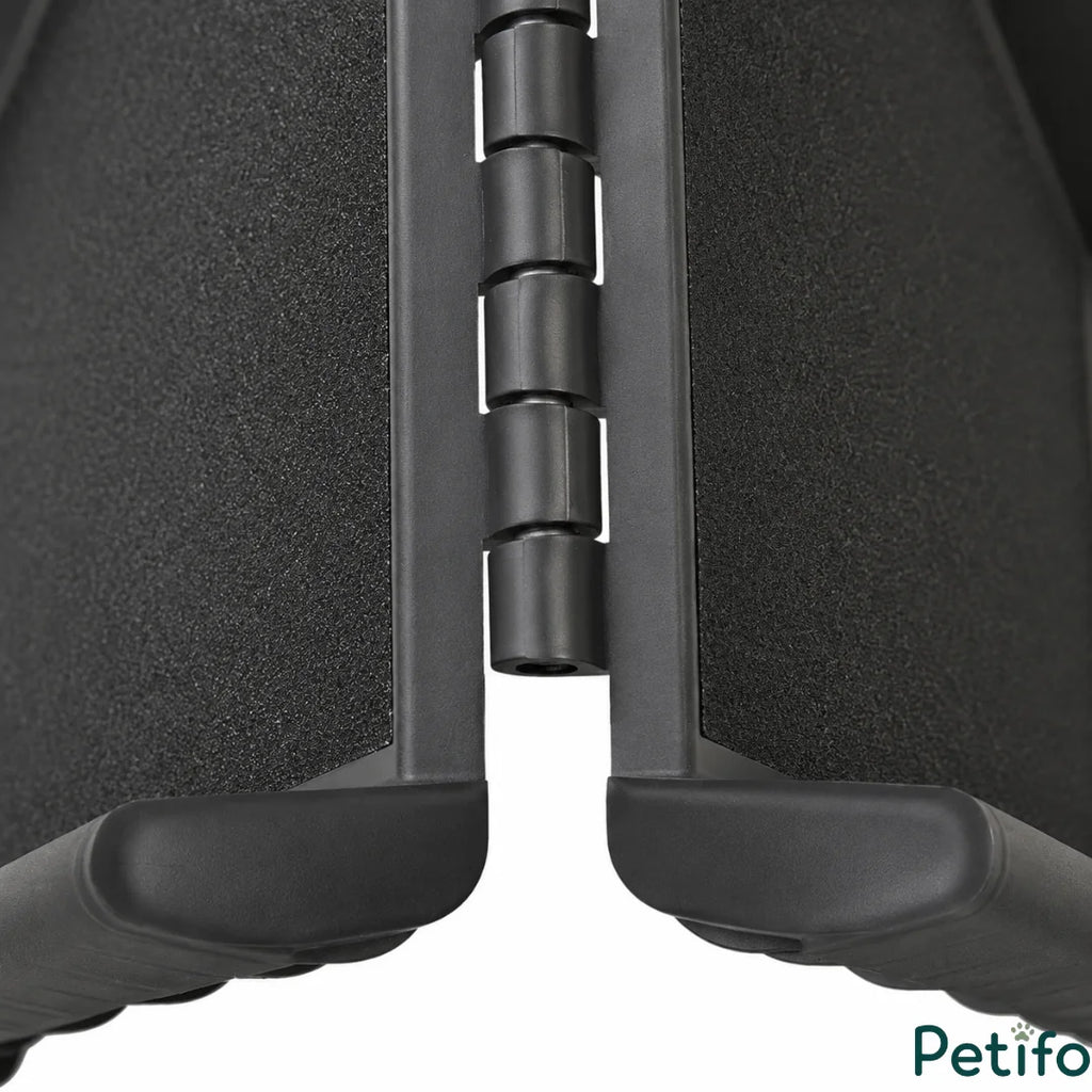 Detailed view of the heavy-duty hinge and integrated handle on the foldable pet car ramp.