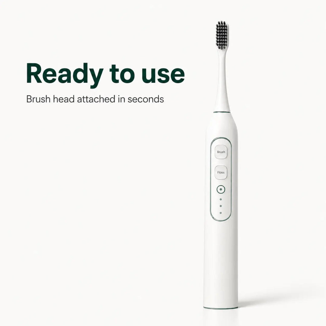 A white electric pet ultrasonic toothbrush with brush and floss mode buttons standing upright.