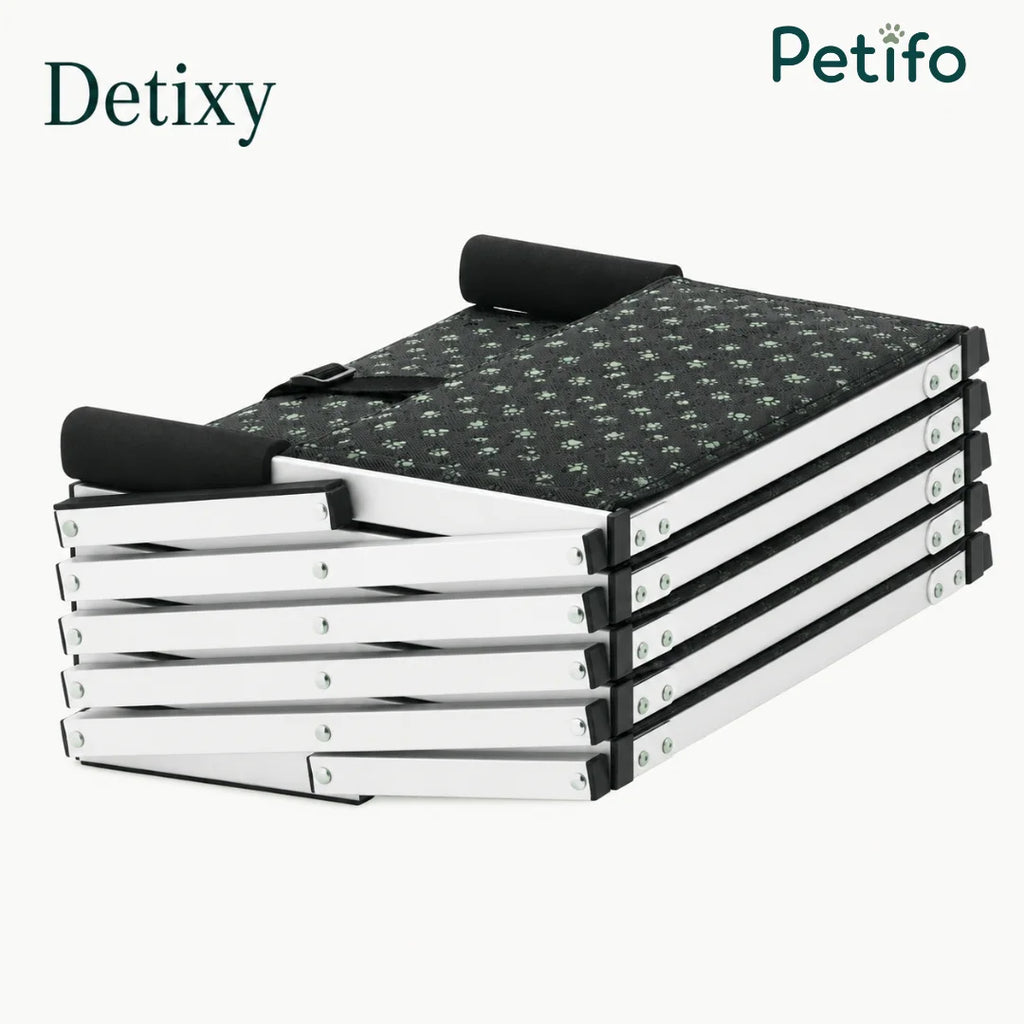 Detixy branded portable dog stairs folded down into a compact, flat position for easy storage.