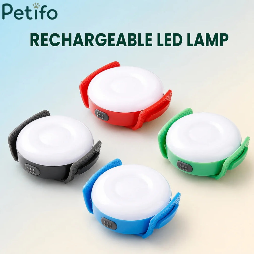 Rechargeable Petifo dog safety lights glowing in white, red, blue, and green colors.