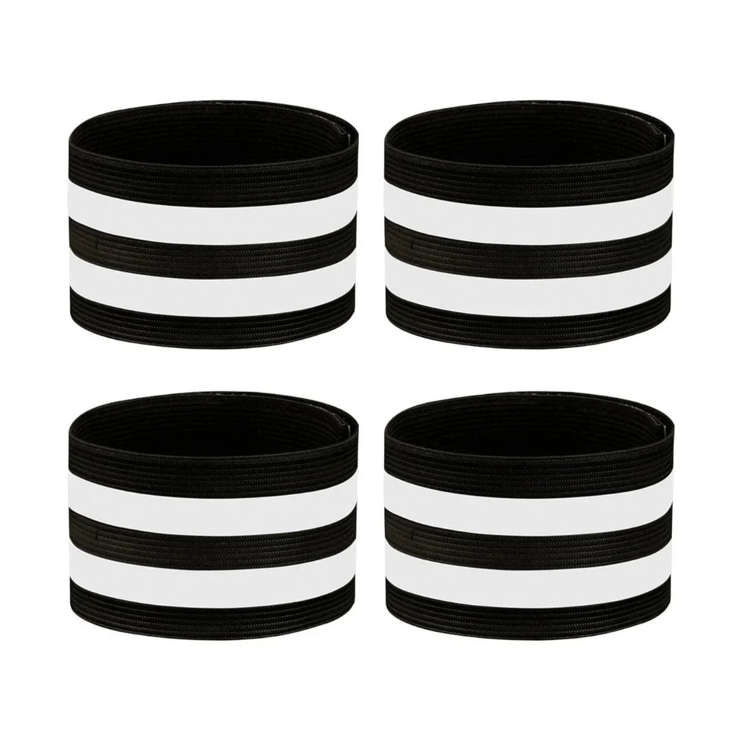 Four black and white reflective horse leg bands arranged on a white background.