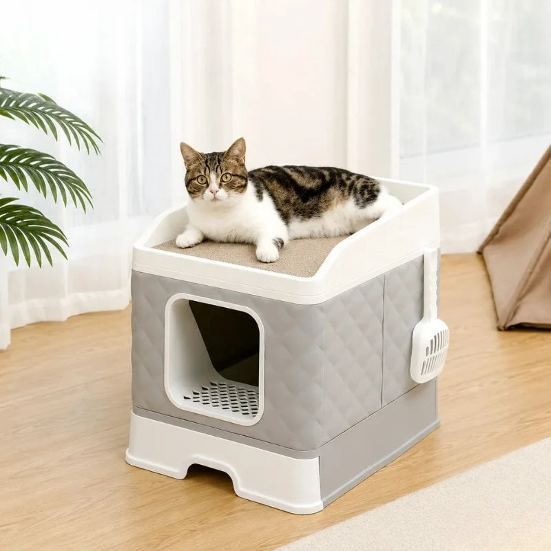 A cat lying on the top scratching surface of a Petifo grey quilted litter box, demonstrating its dual-use functionality