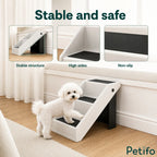 Small white dog using stable, non-slip pet stairs.