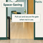 Space-saving retractable safety gate neatly rolled up and secured against the door frame when not in use