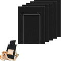Stack of black Petifo replacement scratch pads displayed alongside an assembled wooden dog scratch board and a golden retriever.