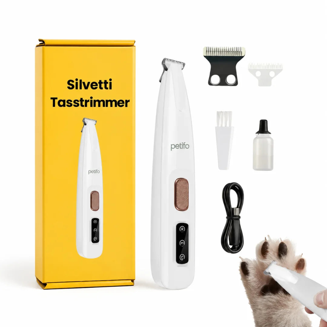  A white wireless pet hair trimmer shown next to its yellow storage box labeled "Silvetti Tasstrimmer", replacement blades, a cleaning brush, an oil bottle, a charging cable, and a paw trimming demonstration.